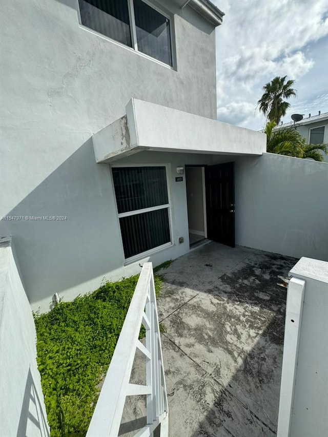 entrance to property with a patio