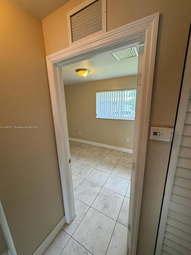 hallway with light tile flooring