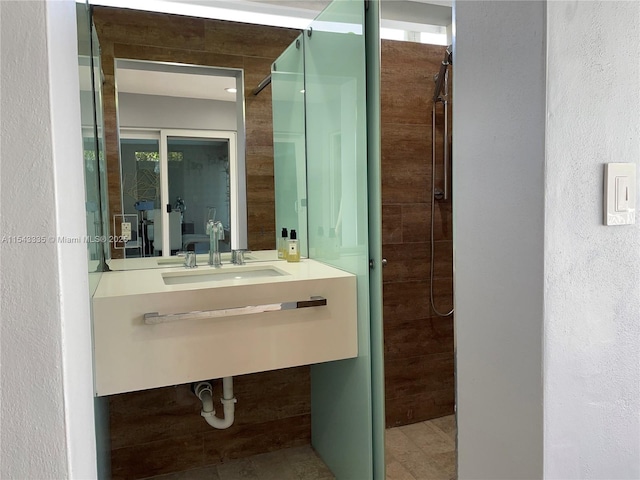 bathroom with sink and walk in shower