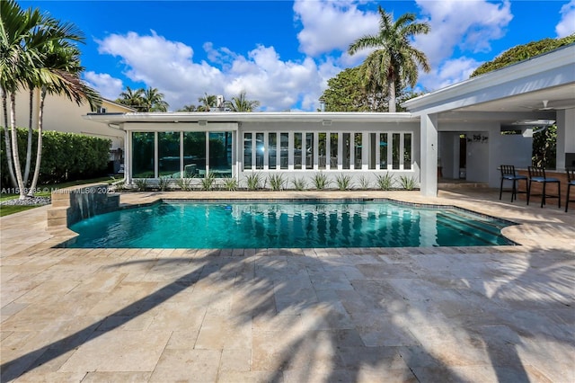 view of swimming pool featuring a patio