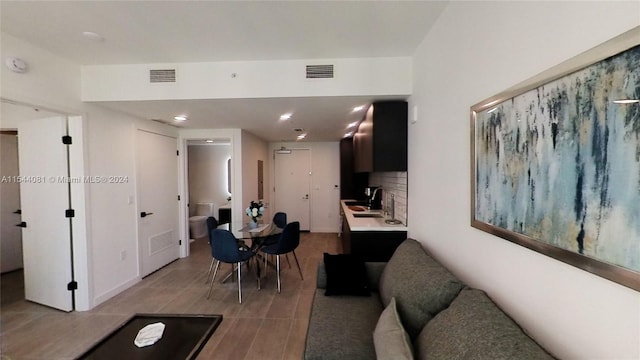 dining space featuring light hardwood / wood-style floors and sink