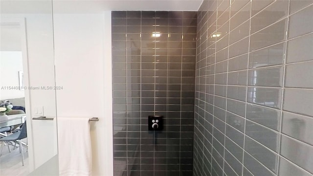 bathroom with a tile shower