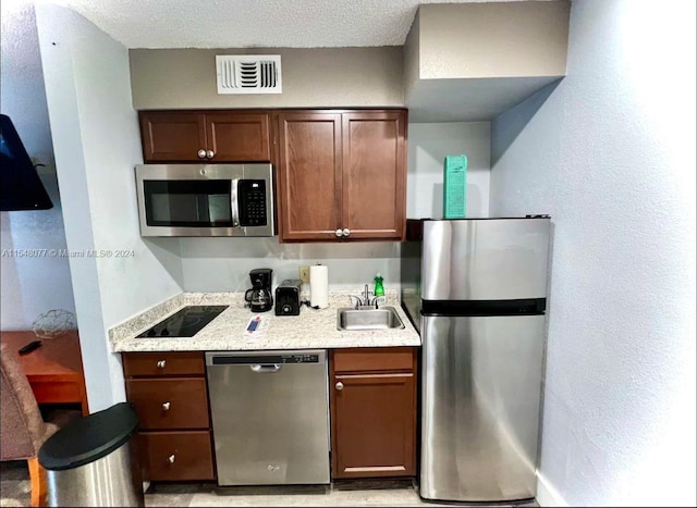 kitchen featuring appliances with stainless steel finishes and sink