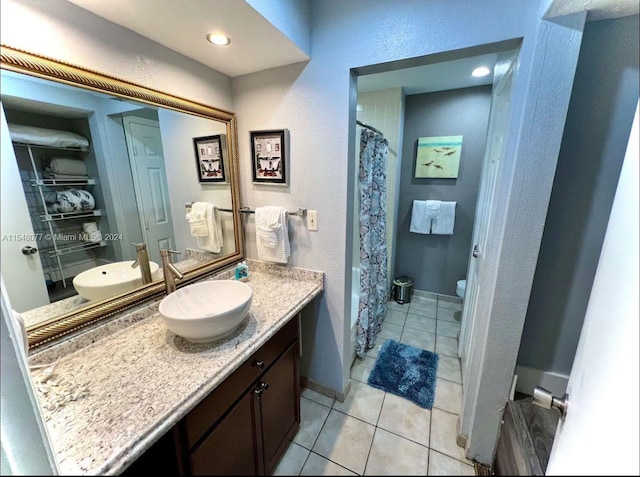 bathroom with tile floors and large vanity