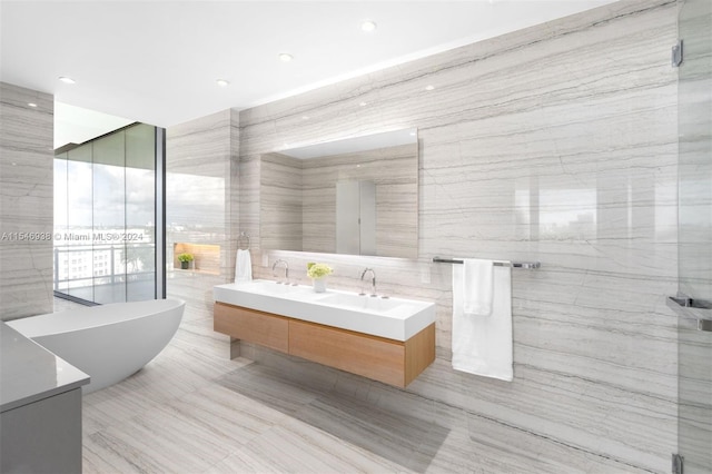 bathroom with floor to ceiling windows, vanity, tile walls, and shower with separate bathtub