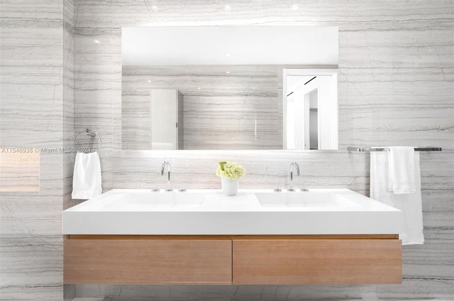 bathroom featuring tile walls and vanity