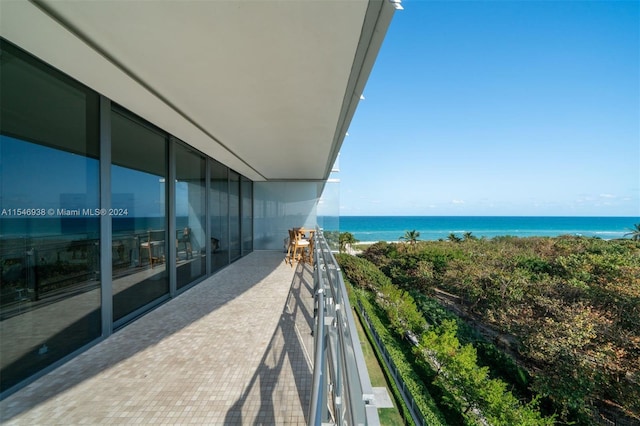 balcony featuring a water view