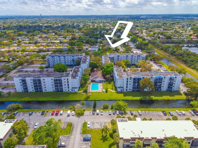 birds eye view of property featuring a water view