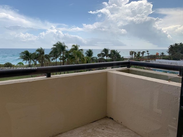 balcony featuring a water view