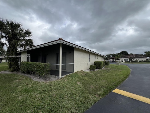 view of property exterior featuring a yard