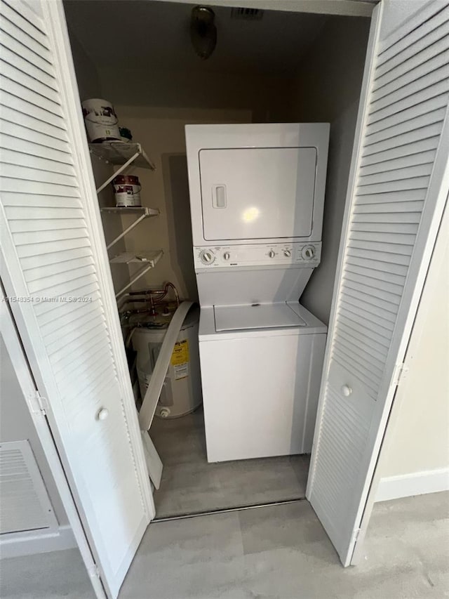 laundry room with stacked washer and dryer