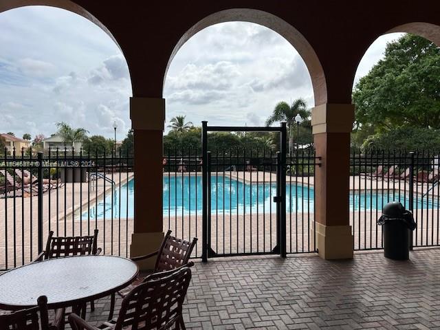 view of swimming pool featuring a patio area