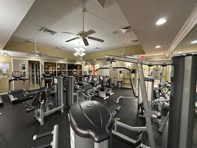 workout area with a textured ceiling and ceiling fan