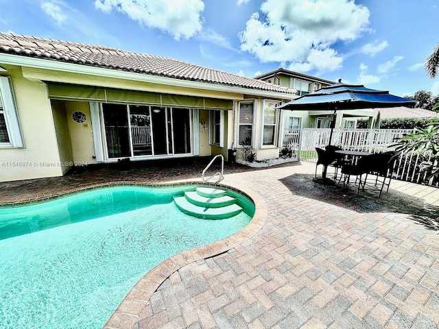 view of swimming pool featuring a patio