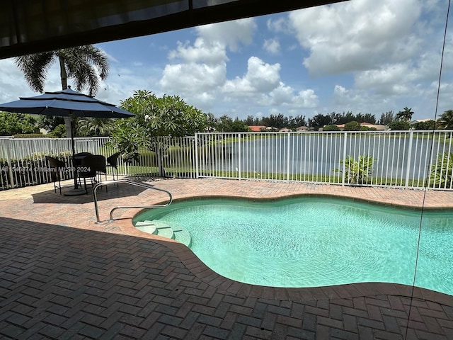 view of swimming pool with a patio