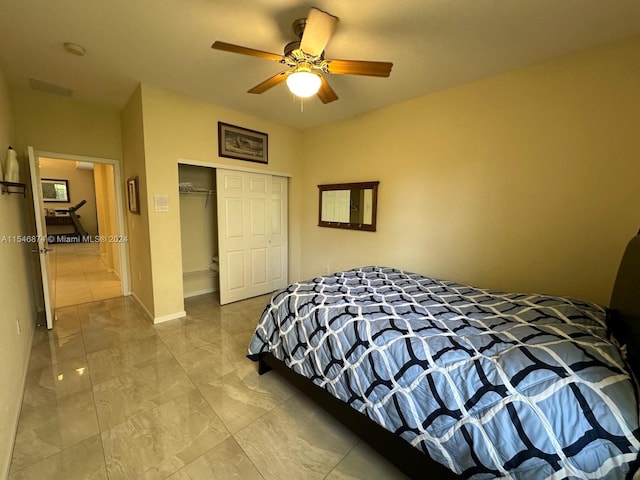 tiled bedroom featuring a closet and ceiling fan