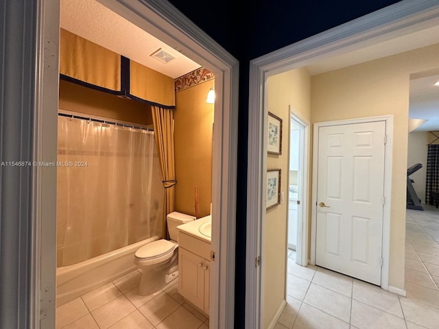 full bathroom with tile patterned flooring, shower / bath combo, toilet, and vanity