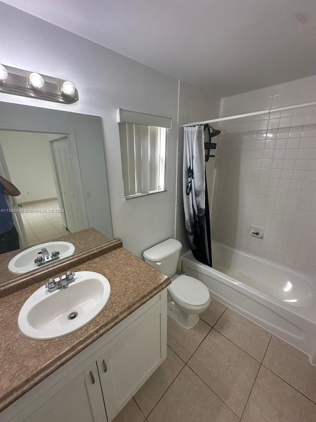 full bathroom with vanity, tile flooring, toilet, and shower / bathtub combination with curtain