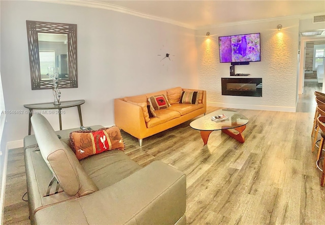 living room featuring crown molding and hardwood / wood-style flooring