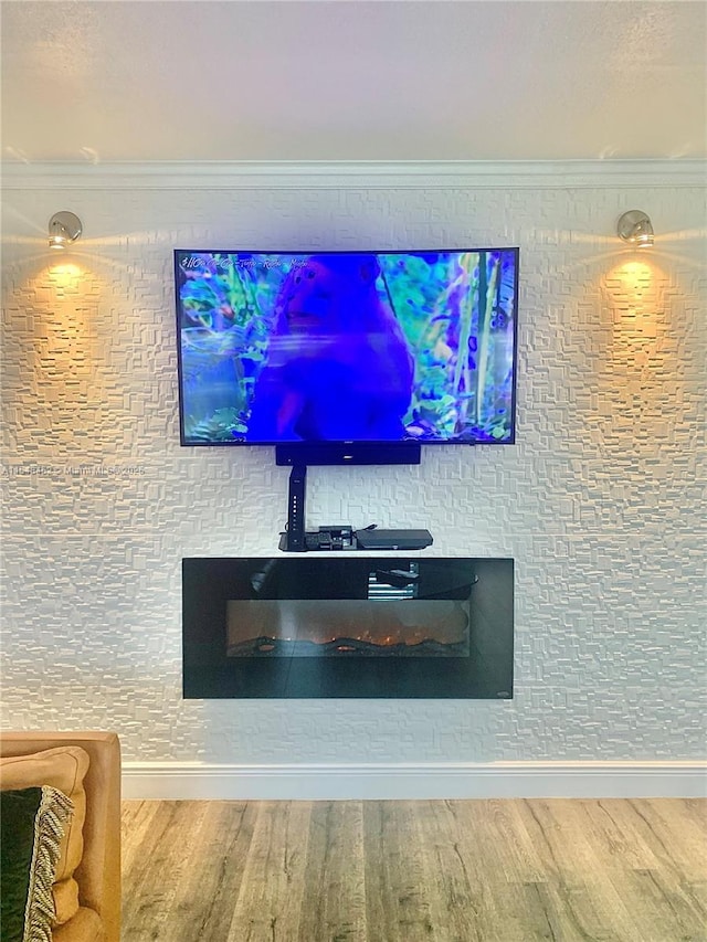 interior details with crown molding and wood-type flooring