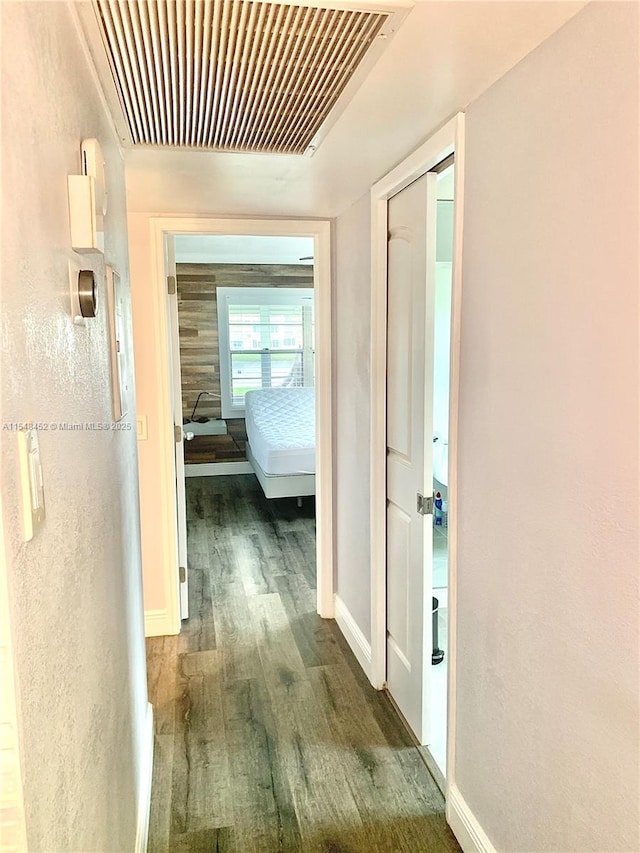 hallway featuring dark wood-type flooring