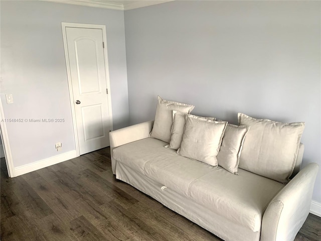 living room with dark wood-type flooring and ornamental molding