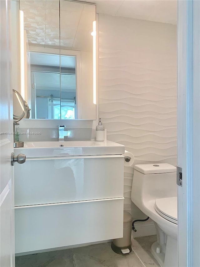 bathroom with vanity and toilet