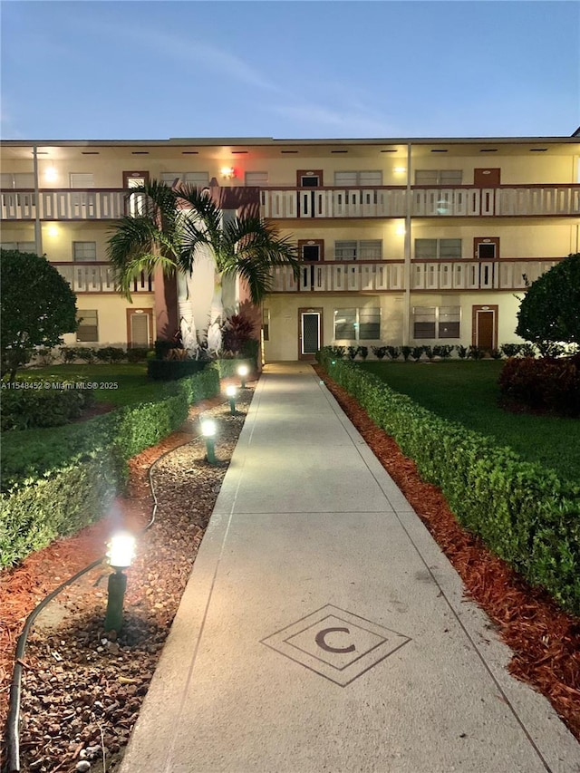 view of outdoor building at dusk