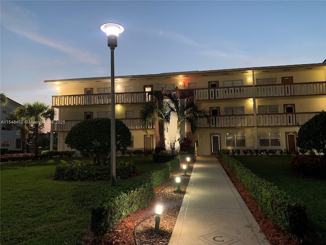 view of outdoor building at dusk