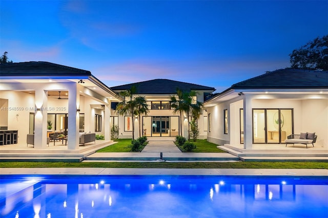 exterior space featuring ceiling fan and a patio area