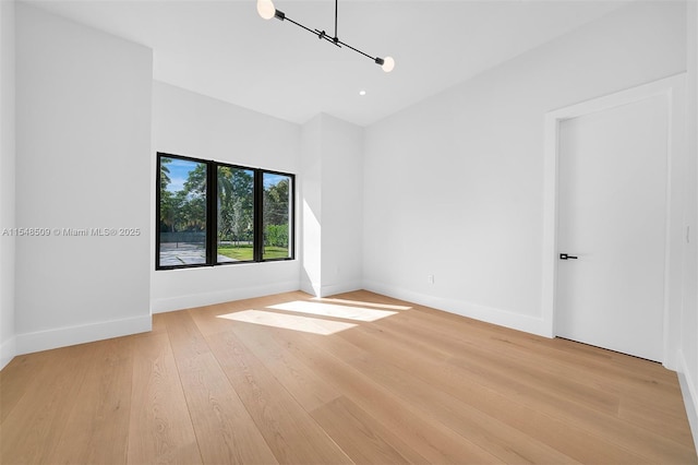 unfurnished room featuring light hardwood / wood-style floors