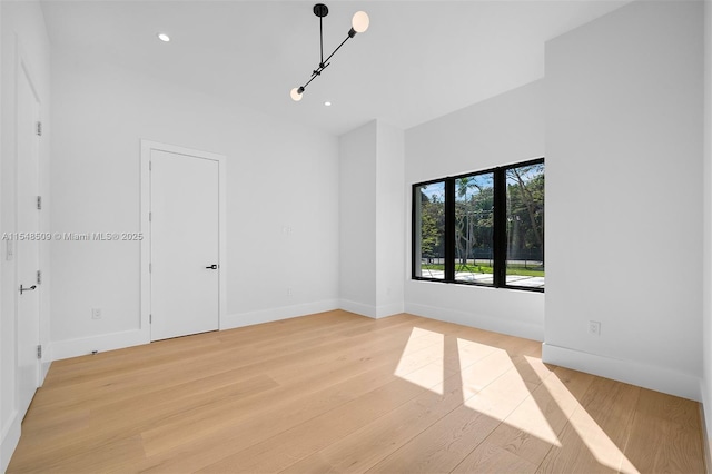 unfurnished room featuring light hardwood / wood-style flooring