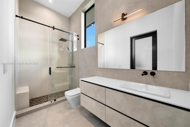 bathroom with tile patterned floors, vanity, toilet, and a shower with door