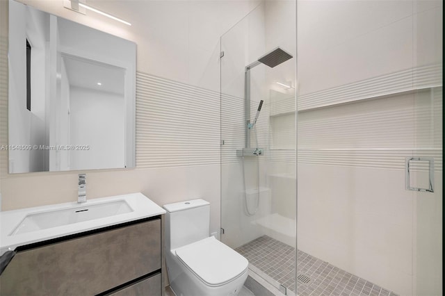 bathroom featuring vanity, toilet, and an enclosed shower