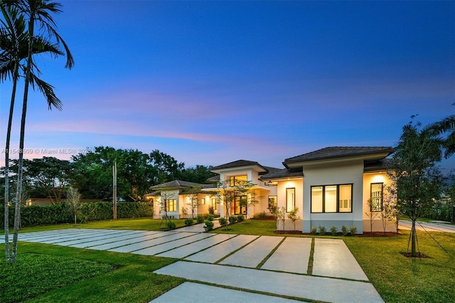 view of front of home with a lawn