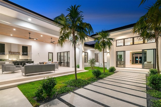 exterior space with an outdoor hangout area and ceiling fan