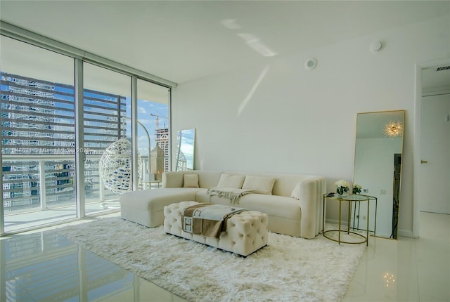 living room with visible vents and floor to ceiling windows