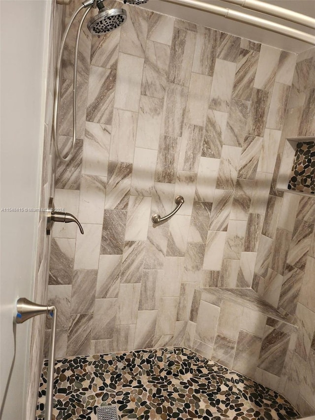 bathroom with tiled shower