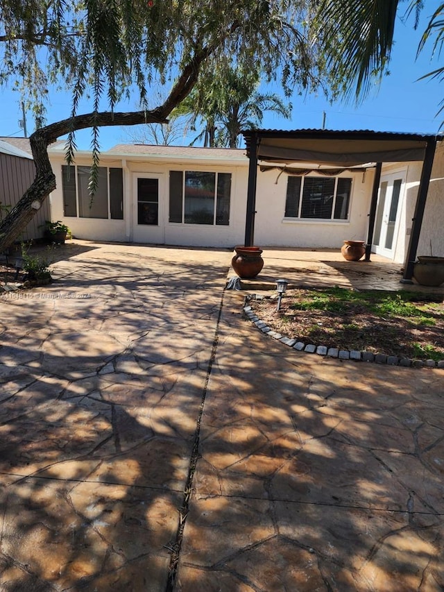 view of front of property featuring a patio and french doors