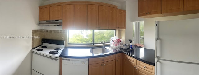 kitchen featuring white appliances and sink