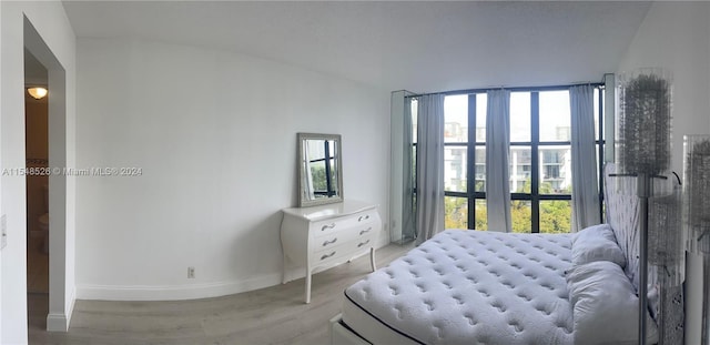 bedroom with lofted ceiling