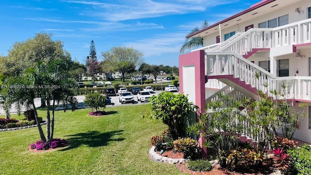 view of home's community with a lawn