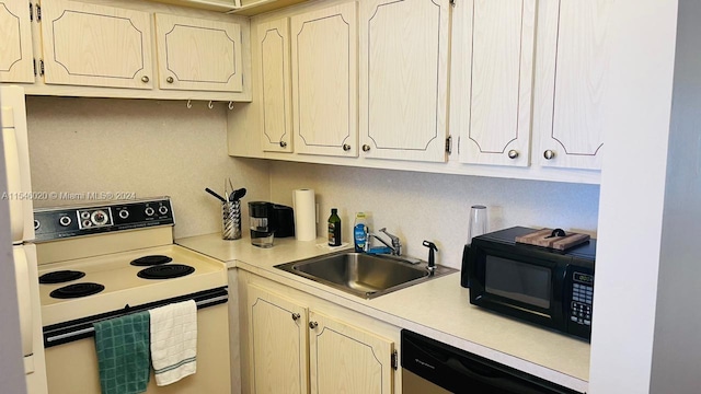 kitchen featuring white appliances and sink