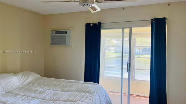 bedroom with light carpet, an AC wall unit, and ceiling fan