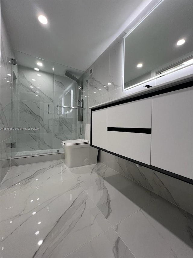 bathroom with walk in shower, vanity, and toilet