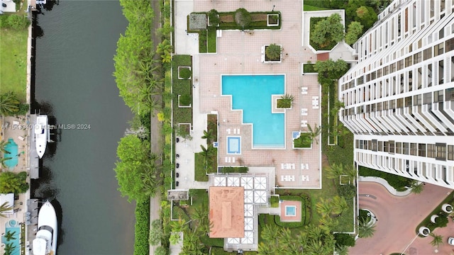 birds eye view of property with a water view