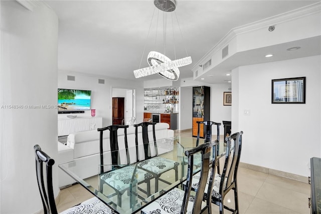 tiled dining space featuring wine cooler and ornamental molding