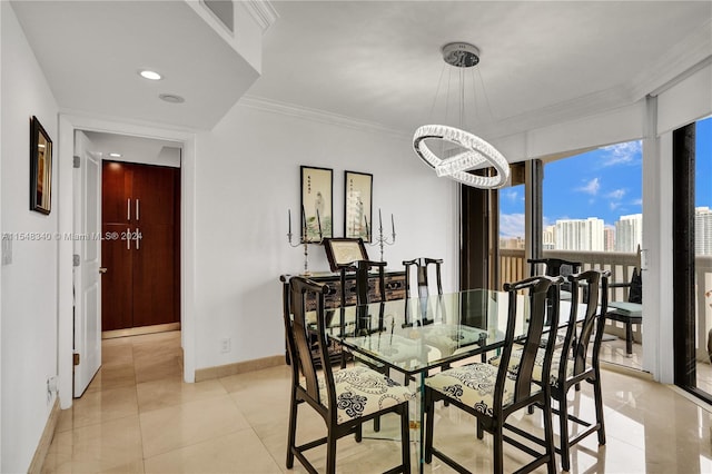 dining room featuring light tile patterned floors and crown molding