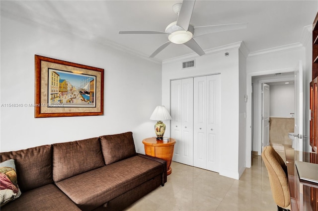 living room featuring ceiling fan, light tile patterned floors, and crown molding