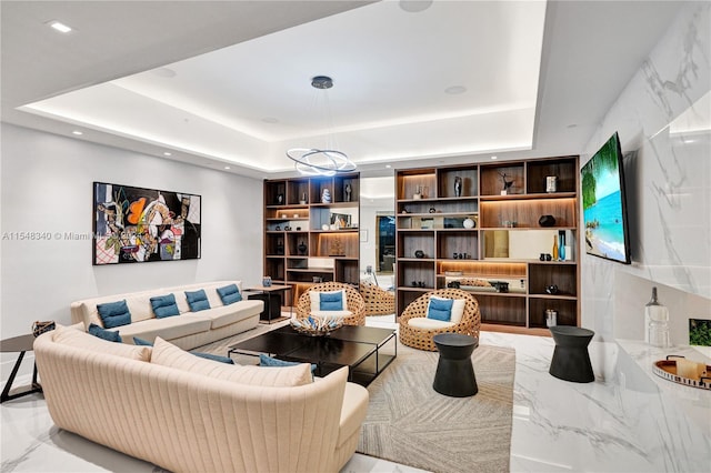 living room featuring a raised ceiling